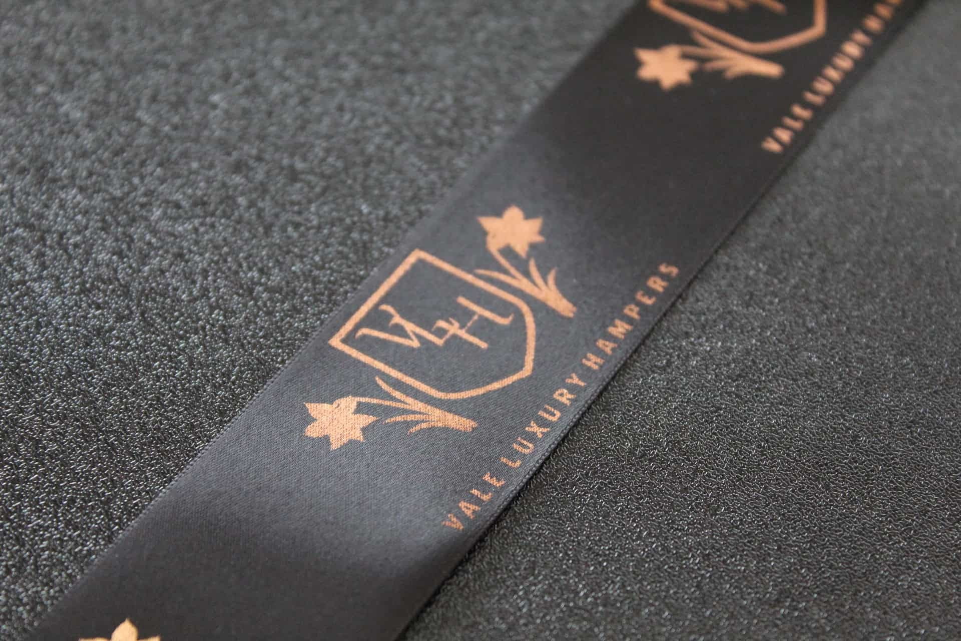 Black Satin Ribbon With Rose Gold Printed Logo Black Satin Ribbon With Rose Gold Printed Logo