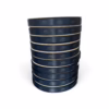 Full colour example - The Ribbon Company Stack of navy blue hockey tape rolls with a repeating maple leaf pattern and white cores, stacked tall against a white background.